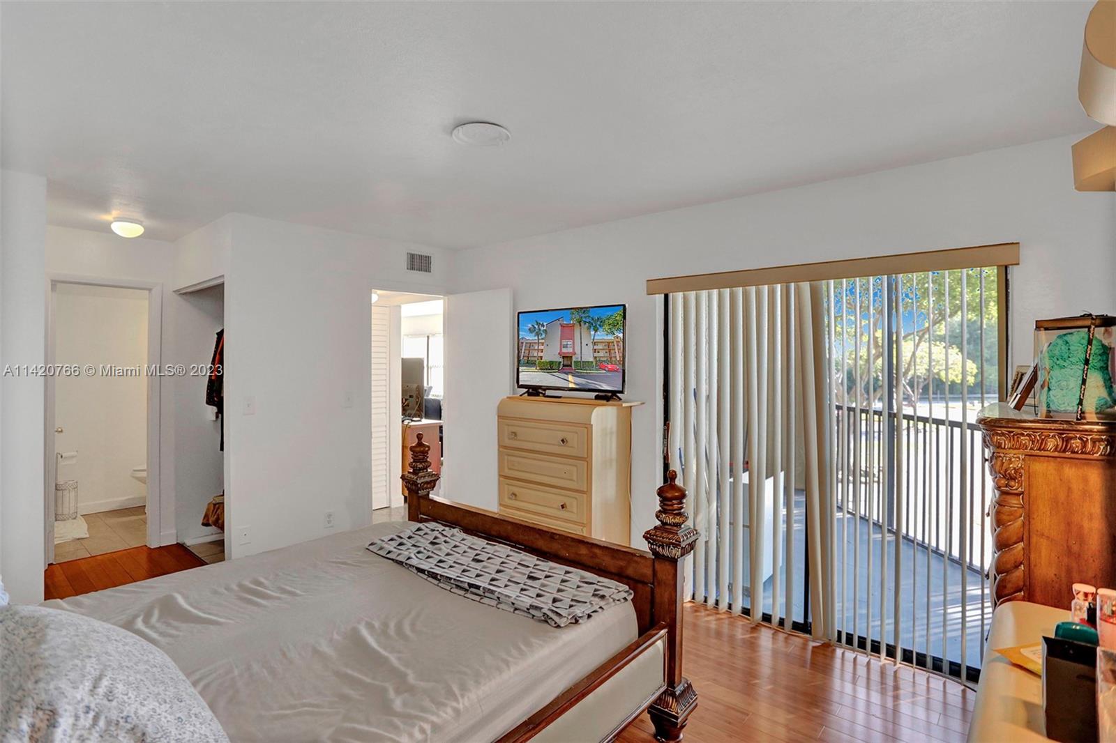 3410 Foxcroft Road, Unit 202 Miramar, FL 33025 - Photo 11 of 35 a bedroom with a bed and a window