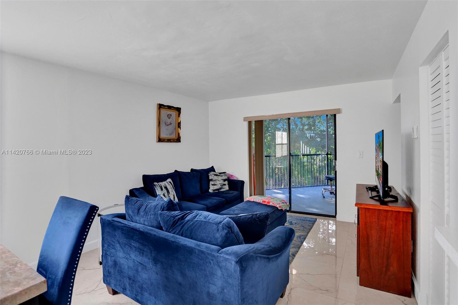 3410 Foxcroft Road, Unit 202 Miramar, FL 33025 - Photo 16 of 35 a living room with furniture and a window