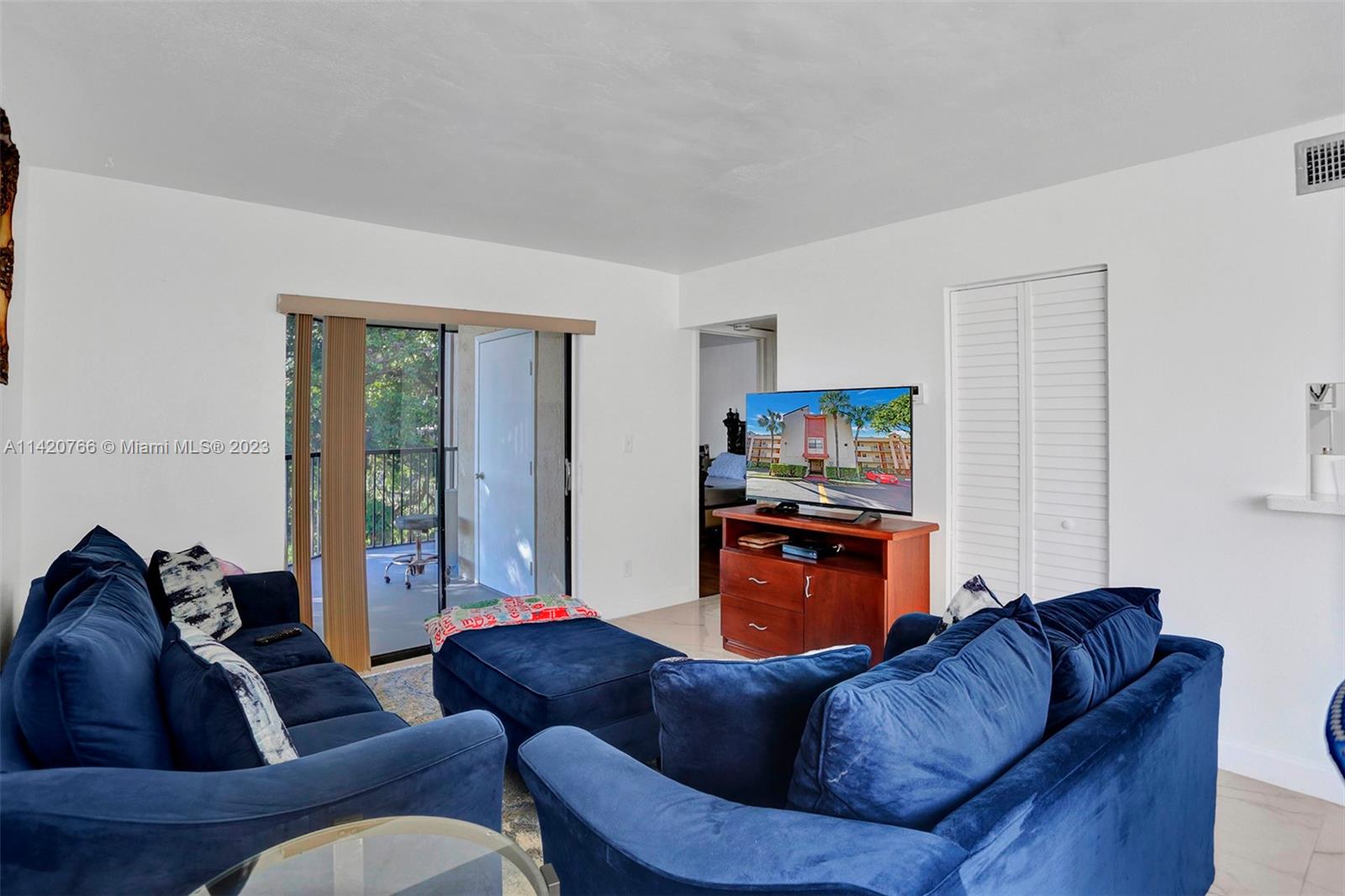 3410 Foxcroft Road, Unit 202 Miramar, FL 33025 - Photo 17 of 35 a living room with furniture and a couch