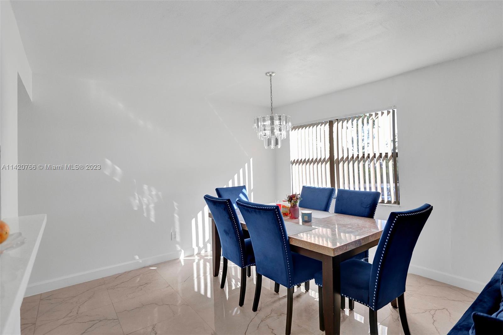 3410 Foxcroft Road, Unit 202 Miramar, FL 33025 - Photo 19 of 35 a view of a dining room with furniture window and outside view