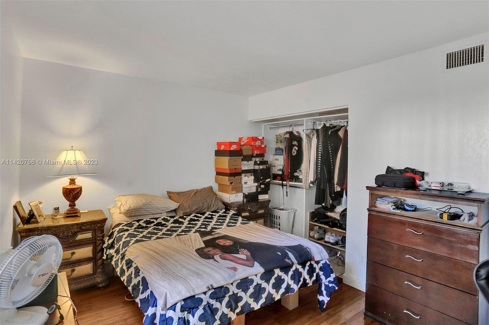 3410 Foxcroft Road, Unit 202 Miramar, FL 33025 - Photo 25 of 35 a bedroom with a bed and dresser