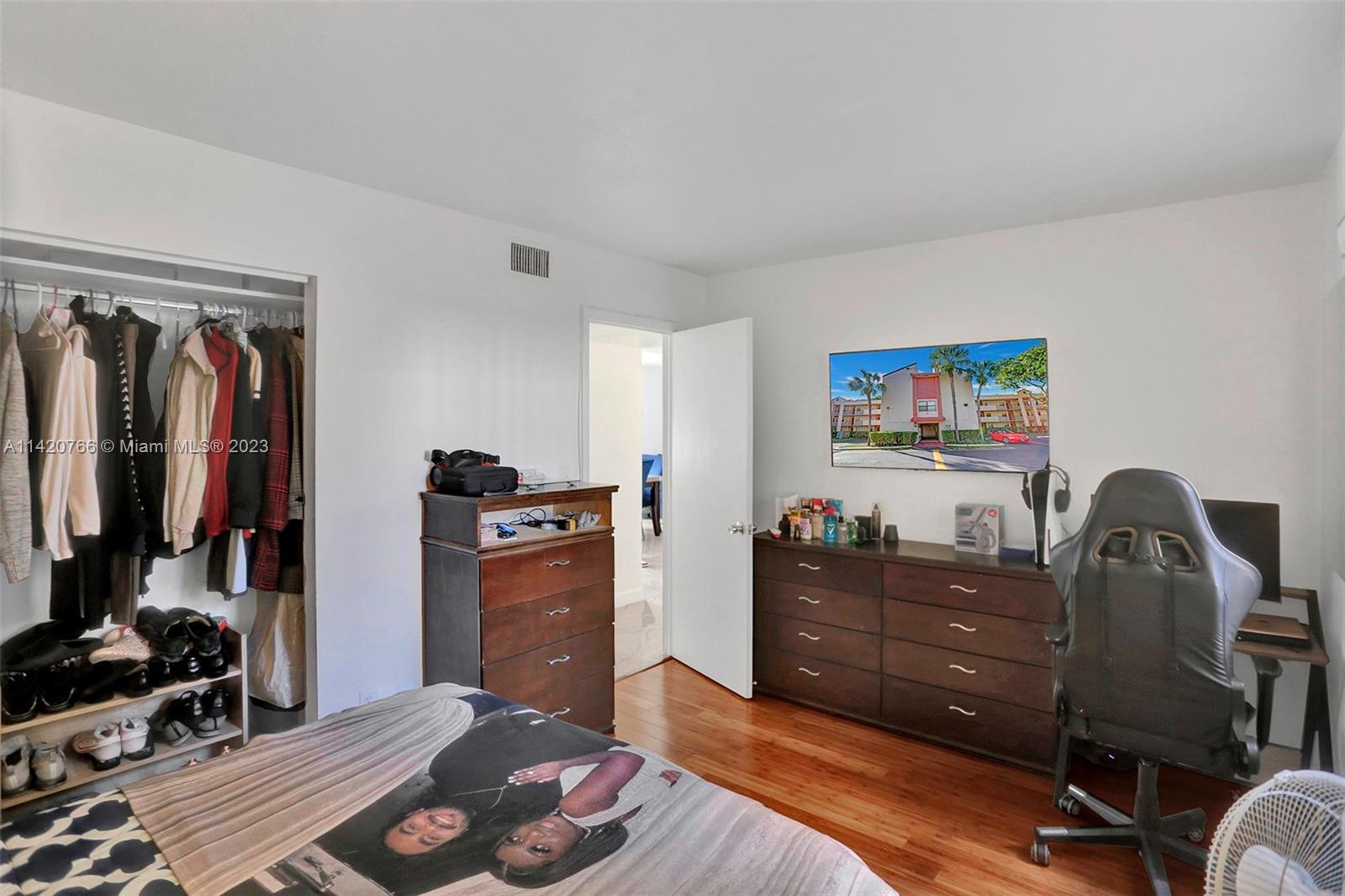 3410 Foxcroft Road, Unit 202 Miramar, FL 33025 - Photo 26 of 35 a bedroom with a workspace