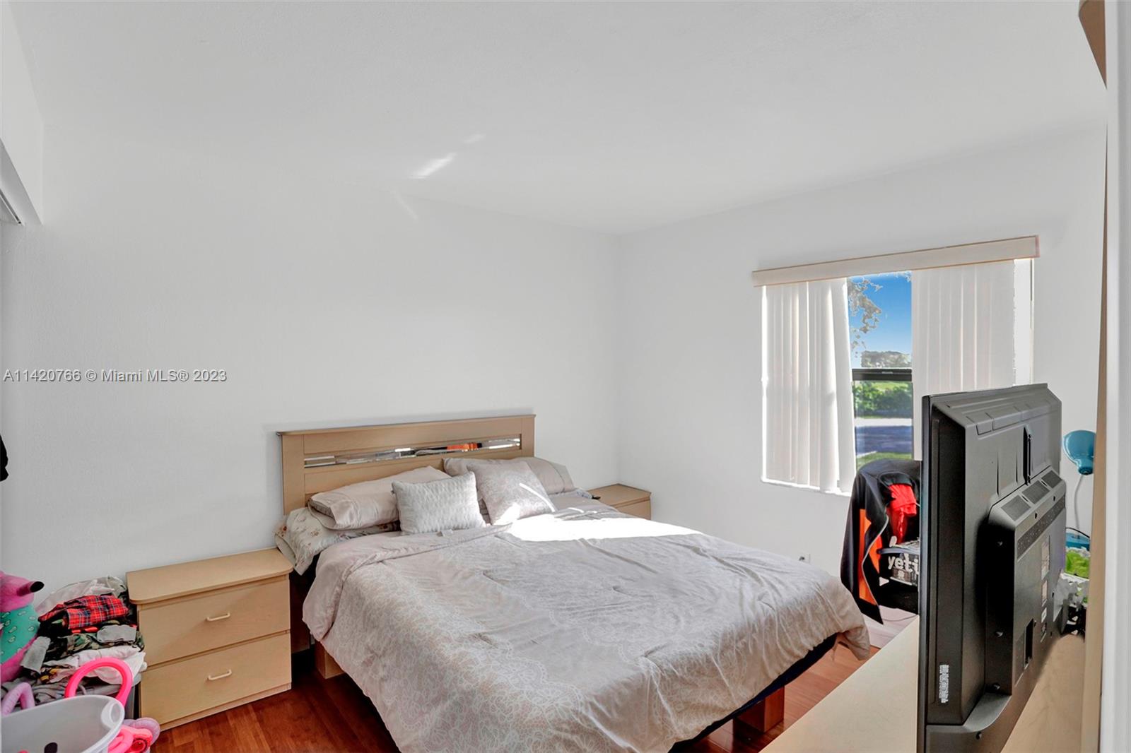 3410 Foxcroft Road, Unit 202 Miramar, FL 33025 - Photo 27 of 35 a bedroom with a bed and a window