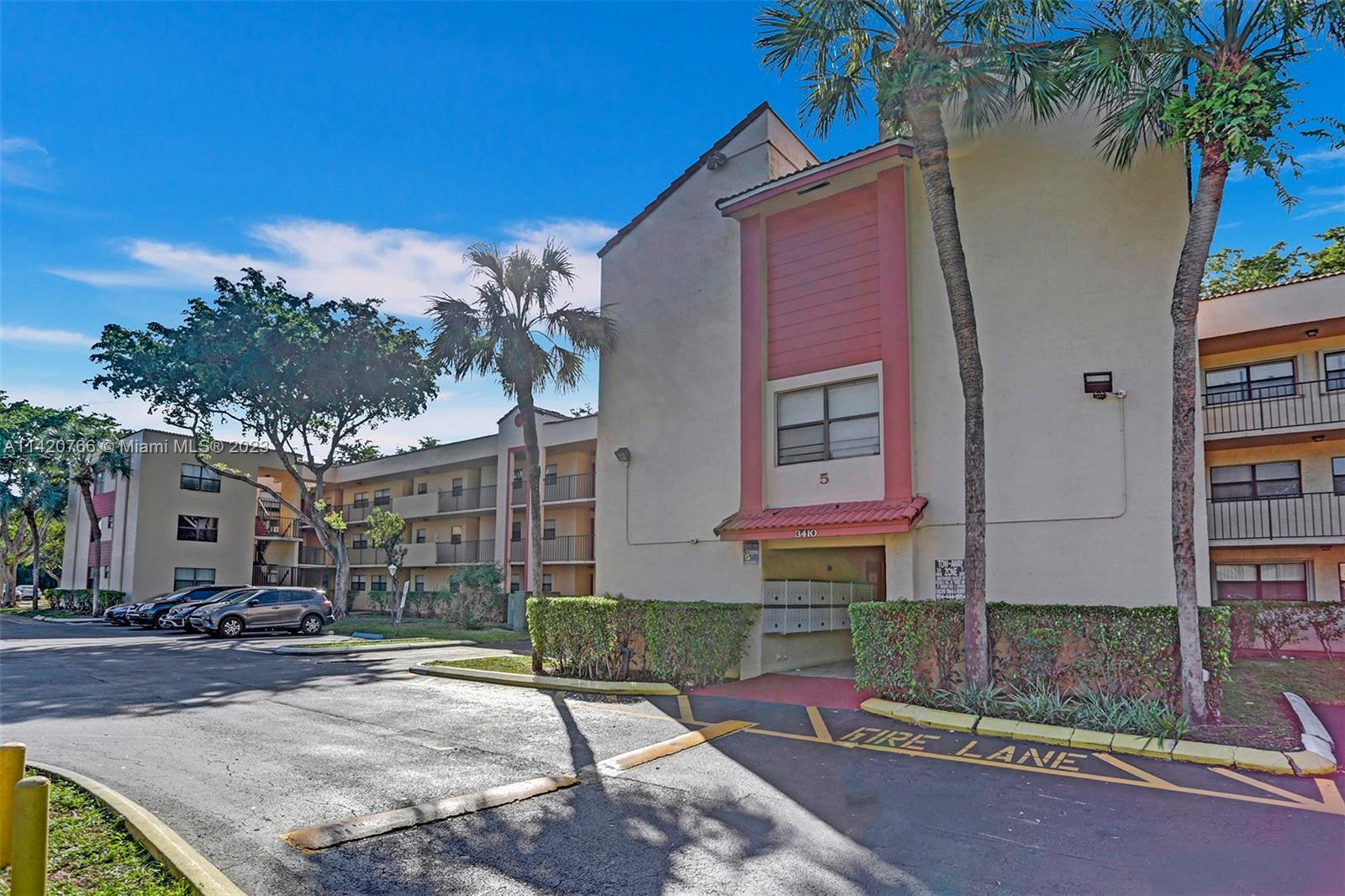 3410 Foxcroft Road, Unit 202 Miramar, FL 33025 - Photo 34 of 35 a front view of a house with garden