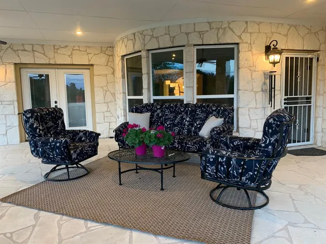 a outdoor living space with furniture and flower garden