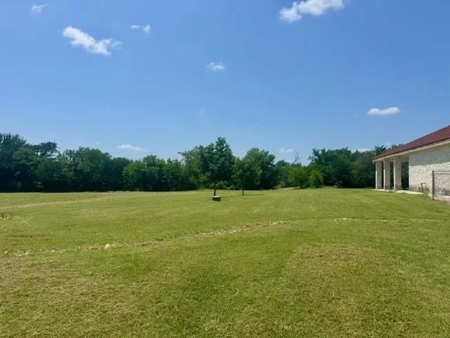 a view of a swimming pool with an ocean view