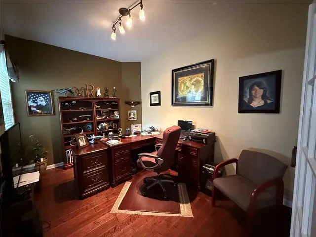 a bedroom with a bed and a television