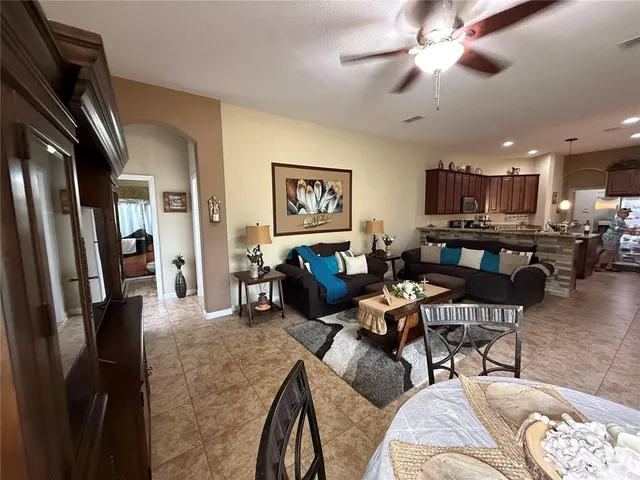 a bathroom with a sink vanity granite tub shower and a mirror