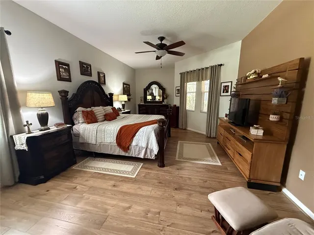 a bathroom with a sink vanity mirror and toilet