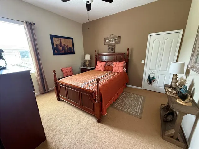 a bedroom with a bed and a dresser