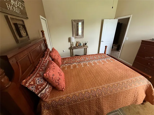 a living room with furniture and a lamp