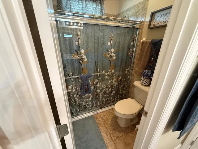 a view of a workspace with furniture and wooden floor