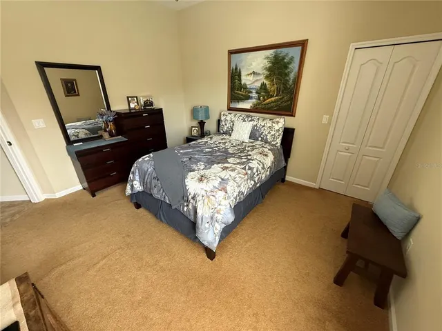 a kitchen with granite countertop a sink a counter top space appliances and cabinets