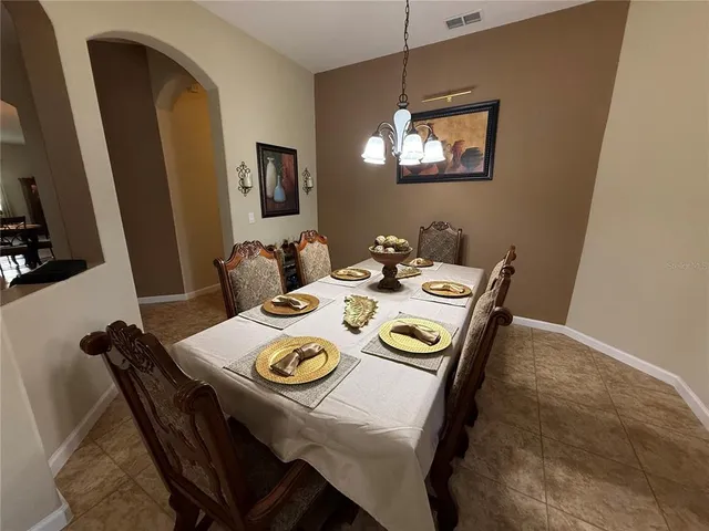 a en suite bathroom with a double vanity sink and a mirror