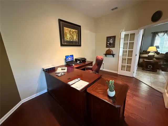 a bathroom with a sink mirror vanity and toilet