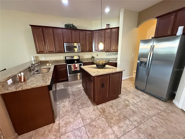 a bathroom with a sink a mirror and a shower