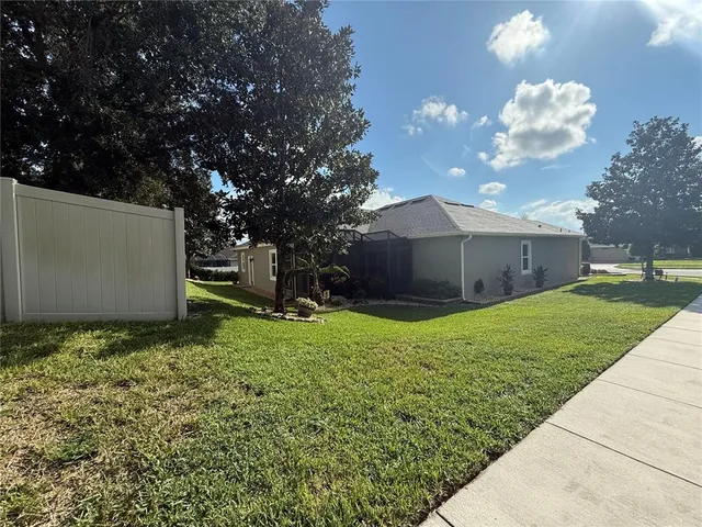 a view of a dining room with furniture and a large window