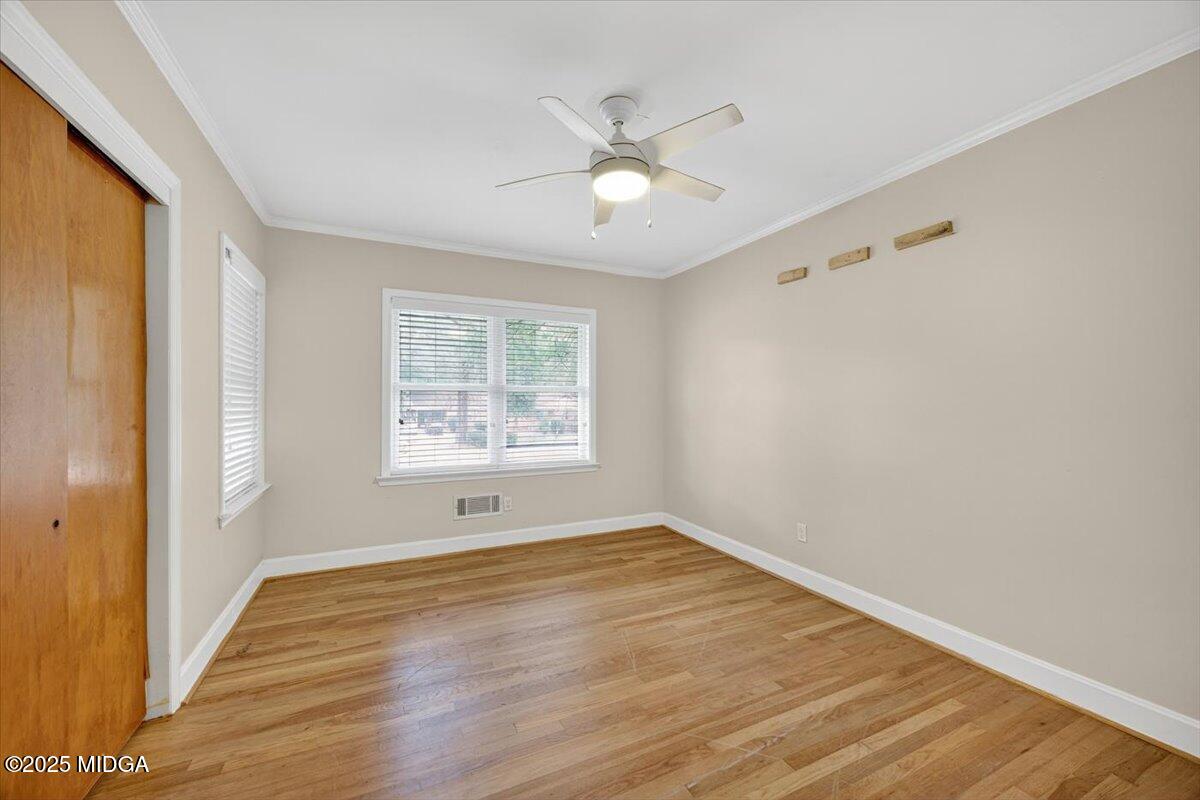 84 Hillsdale Road Forsyth, GA 31029 - Photo 14 of 27 a view of an empty room with wooden floor and a window