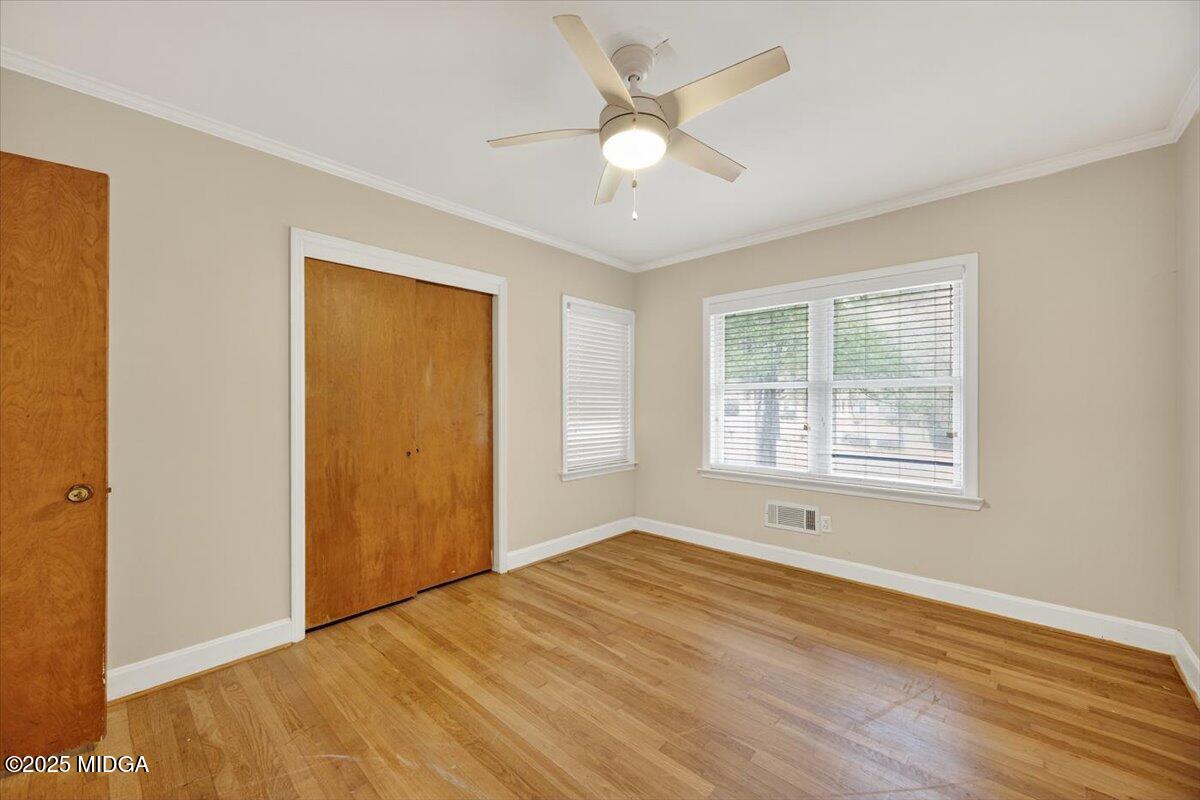 84 Hillsdale Road Forsyth, GA 31029 - Photo 15 of 27 a view of an empty room with wooden floor and a window