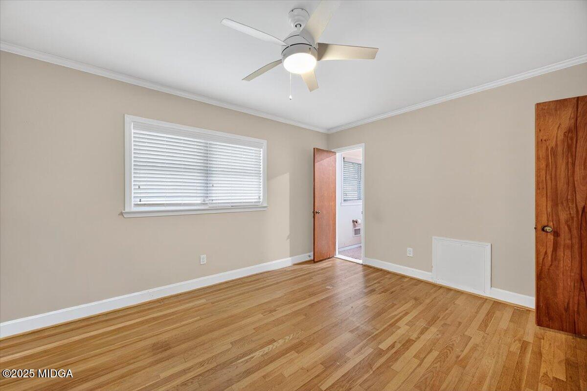 84 Hillsdale Road Forsyth, GA 31029 - Photo 17 of 27 a view of an empty room with wooden floor and a window