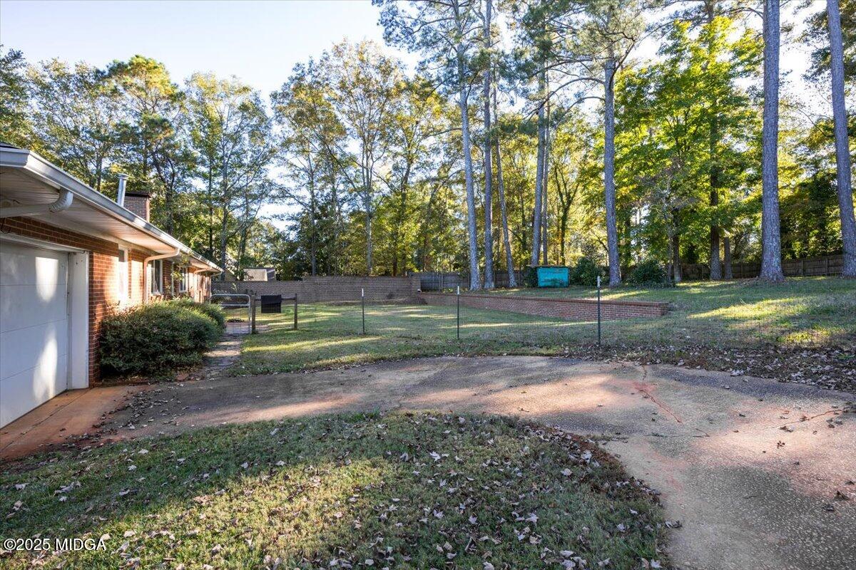 84 Hillsdale Road Forsyth, GA 31029 - Photo 23 of 27 a view of a yard with tree s