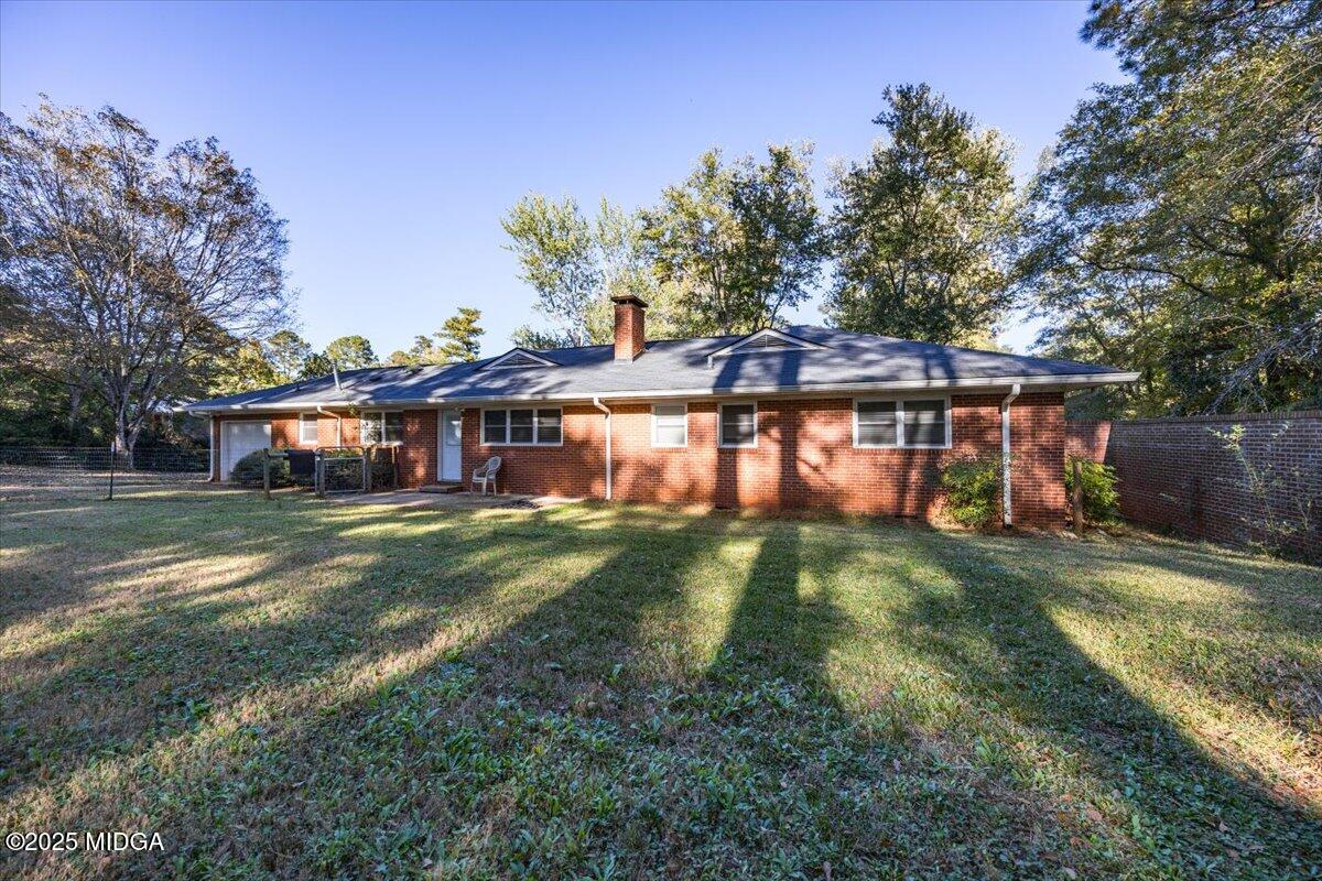 84 Hillsdale Road Forsyth, GA 31029 - Photo 27 of 27 a front view of house with yard and trees in the background