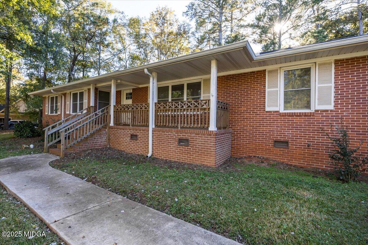 84 Hillsdale Road Forsyth, GA 31029 - Photo 3 of 27 front view of a house with a yard