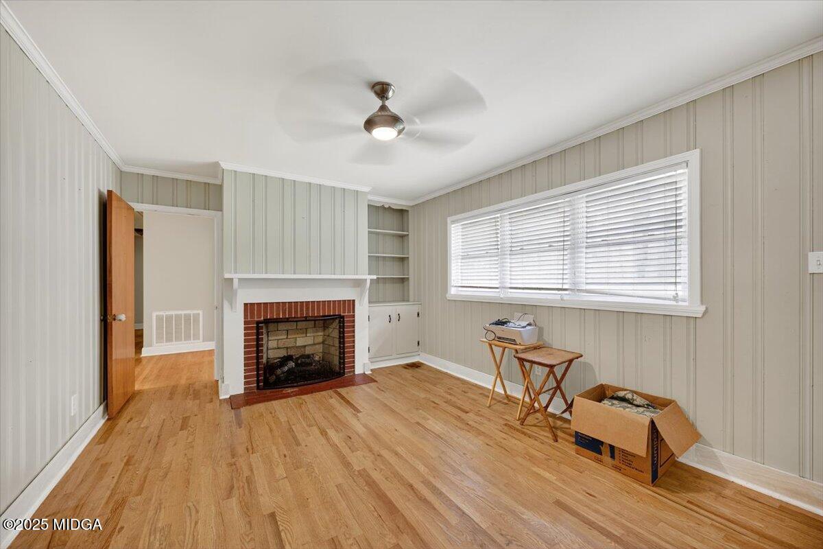 84 Hillsdale Road Forsyth, GA 31029 - Photo 10 of 27 a living room with furniture and a fireplace