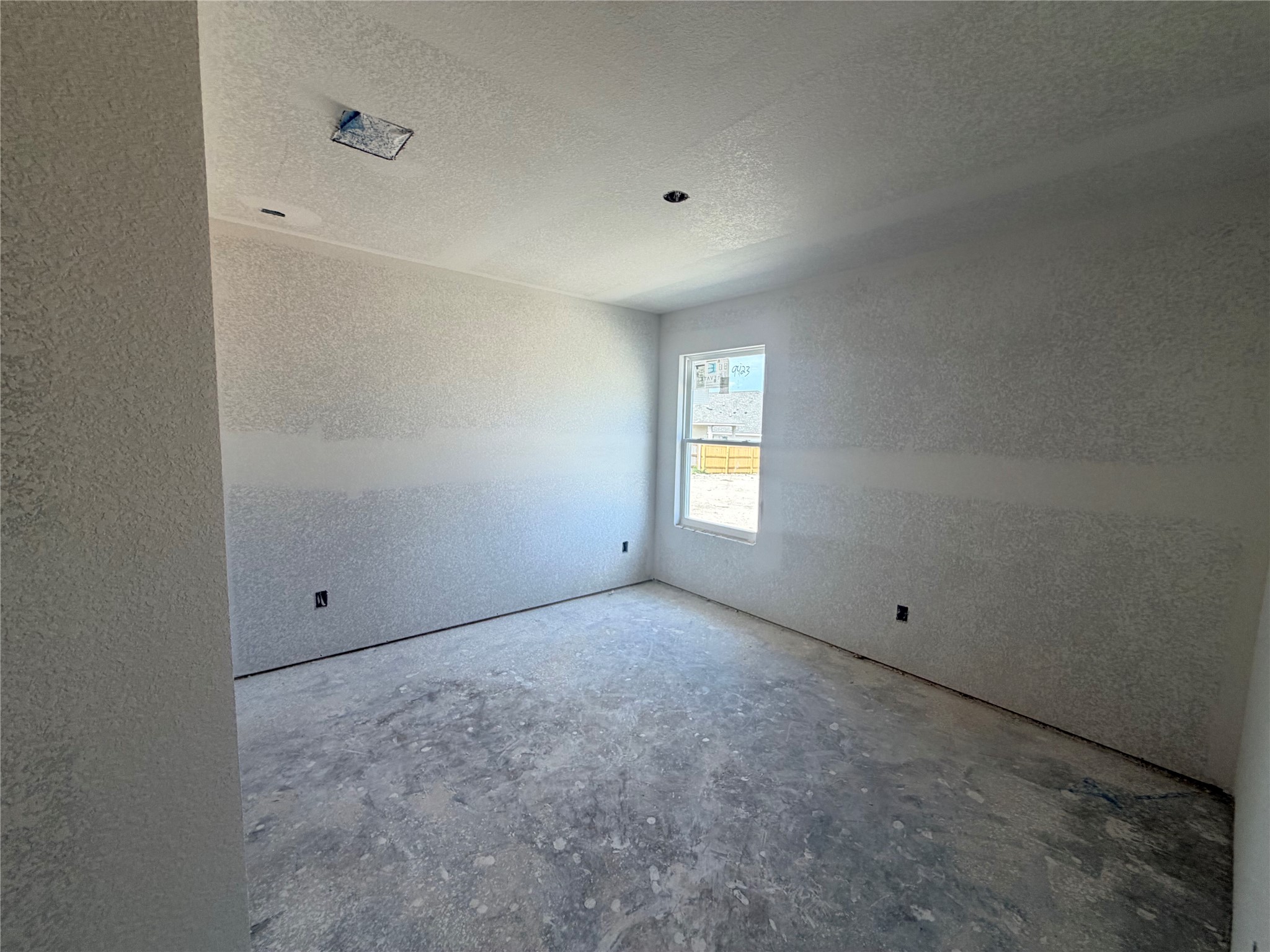 237 Lazy Lizzy Road Jarrell, TX 76537 - Photo 6 of 18 A single window illuminates this unfinished room under construction.