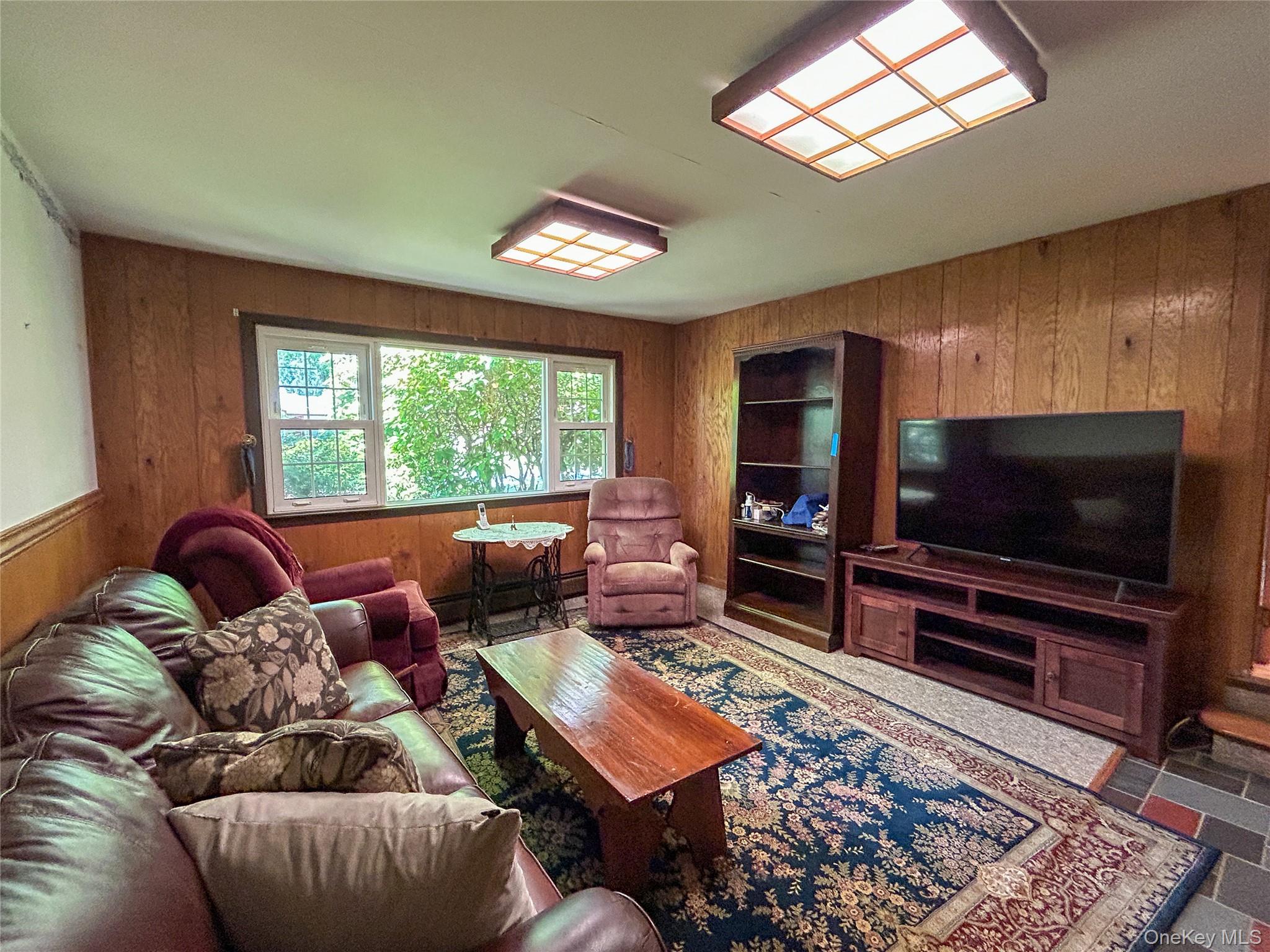 3 Johnston Road Livingston Manor, NY 12758 - Photo 13 of 43 a living room with furniture and a flat screen tv