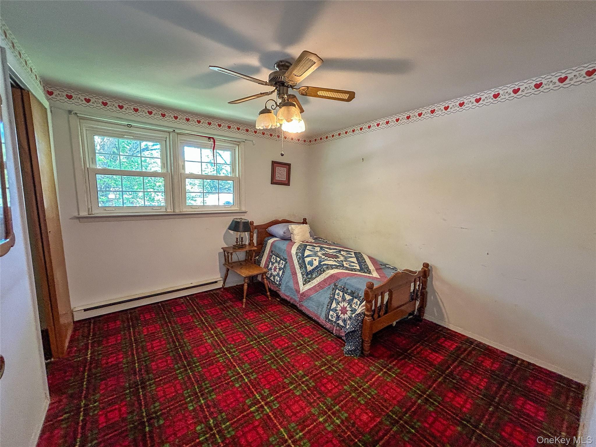 3 Johnston Road Livingston Manor, NY 12758 - Photo 27 of 43 a living room with a bed furniture and a chandelier