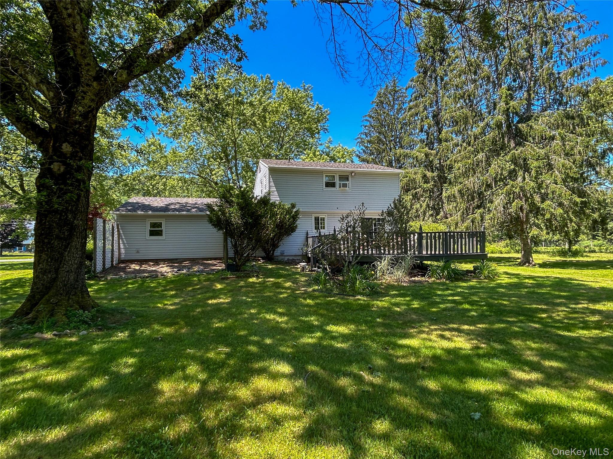 3 Johnston Road Livingston Manor, NY 12758 - Photo 38 of 43 a backyard of a house with table and chairs