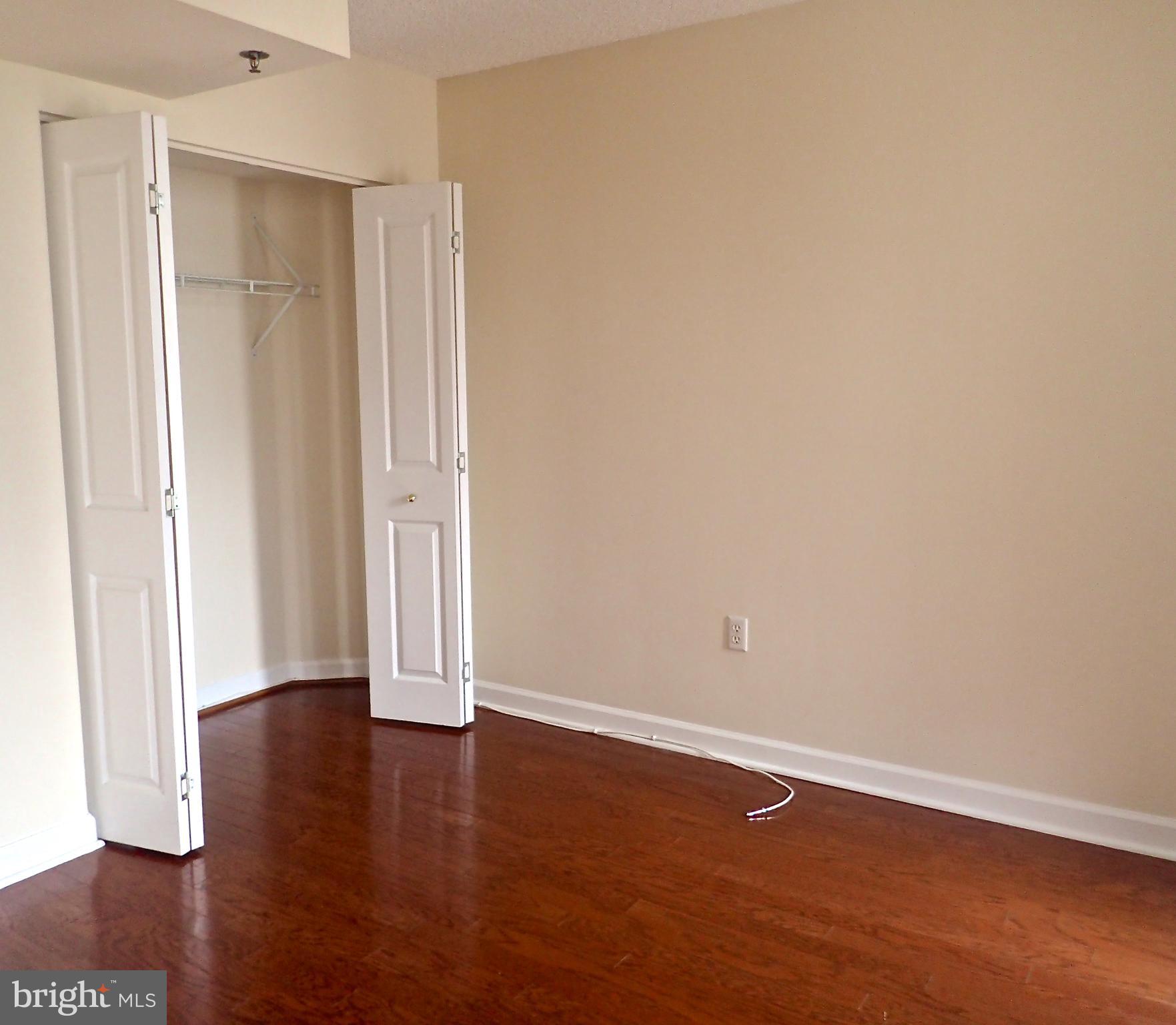601 Pennsylvania Avenue Northwest, Unit 609 Washington, DC 20004 - Photo 13 of 33 Bedroom with hardwoods, closet