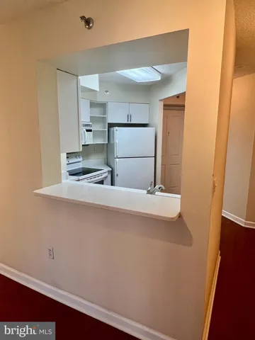 a view of parking space with parked cars