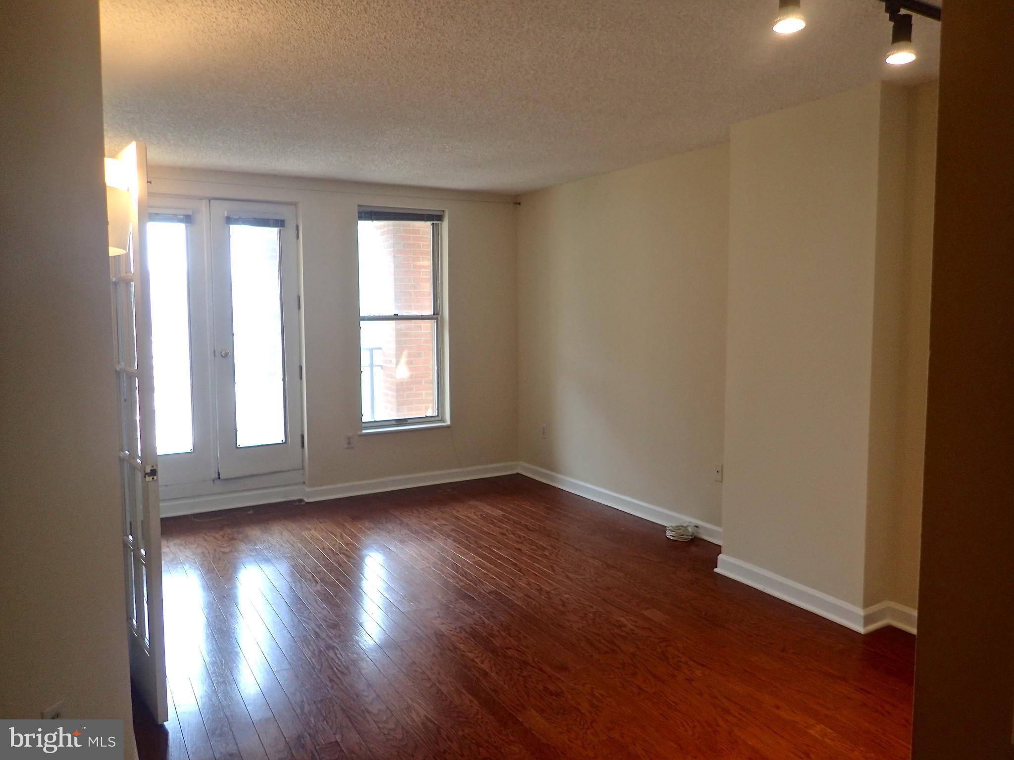 601 Pennsylvania Avenue Northwest, Unit 609 Washington, DC 20004 - Photo 5 of 33 Light and airy living room, gorgeous hardwoods