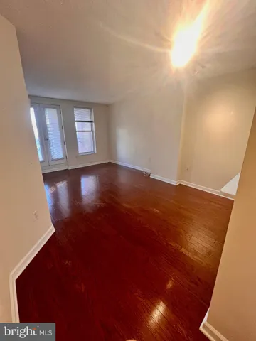 a kitchen with stainless steel appliances a refrigerator sink and white cabinets