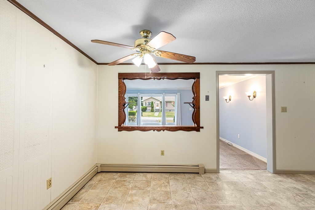 99 Swansom Road Swansea, MA 02777 - Photo 14 of 42 an empty room with wooden floor and windows