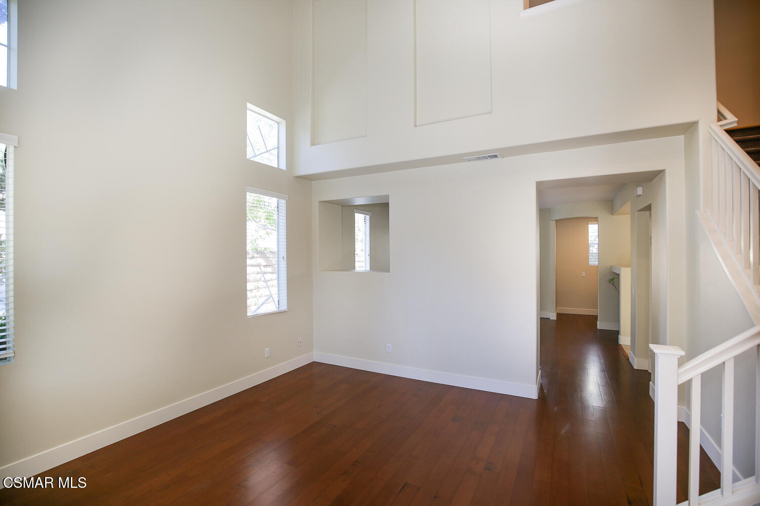 1129 Azalea Way Simi Valley, CA 93065 - Photo 5 of 50 a view of an empty room with wooden floor and a window
