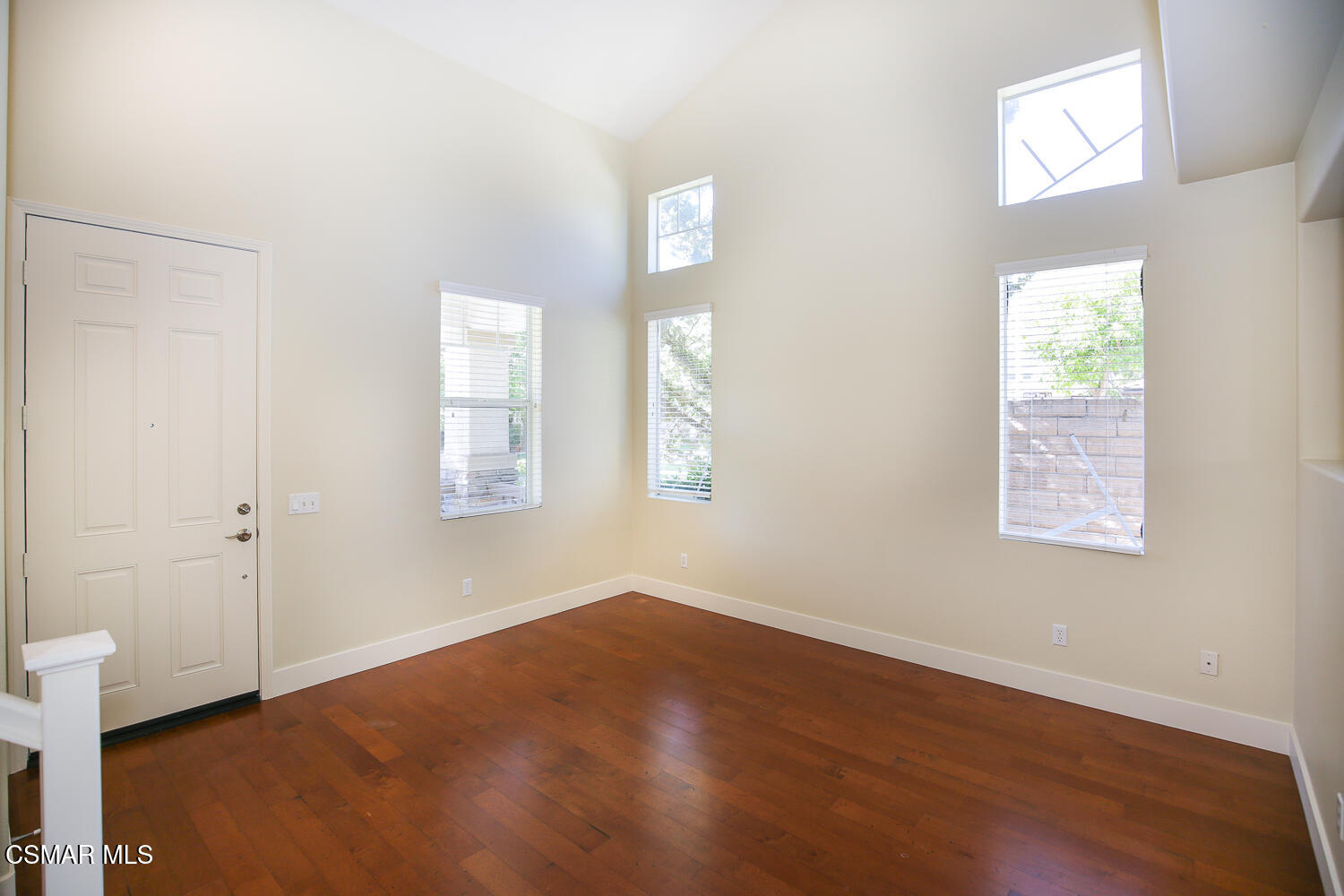 1129 Azalea Way Simi Valley, CA 93065 - Photo 6 of 50 an empty room with wooden floor and windows