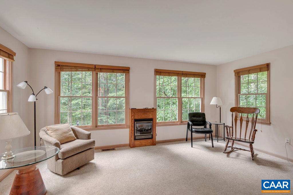 4875 Mechunk Road Keswick, VA 22947 - Photo 11 of 38 a living room with furniture and a floor to ceiling window