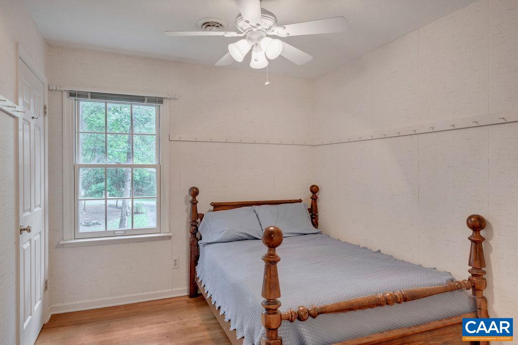 4875 Mechunk Road Keswick, VA 22947 - Photo 18 of 38 a bedroom with a bed and window