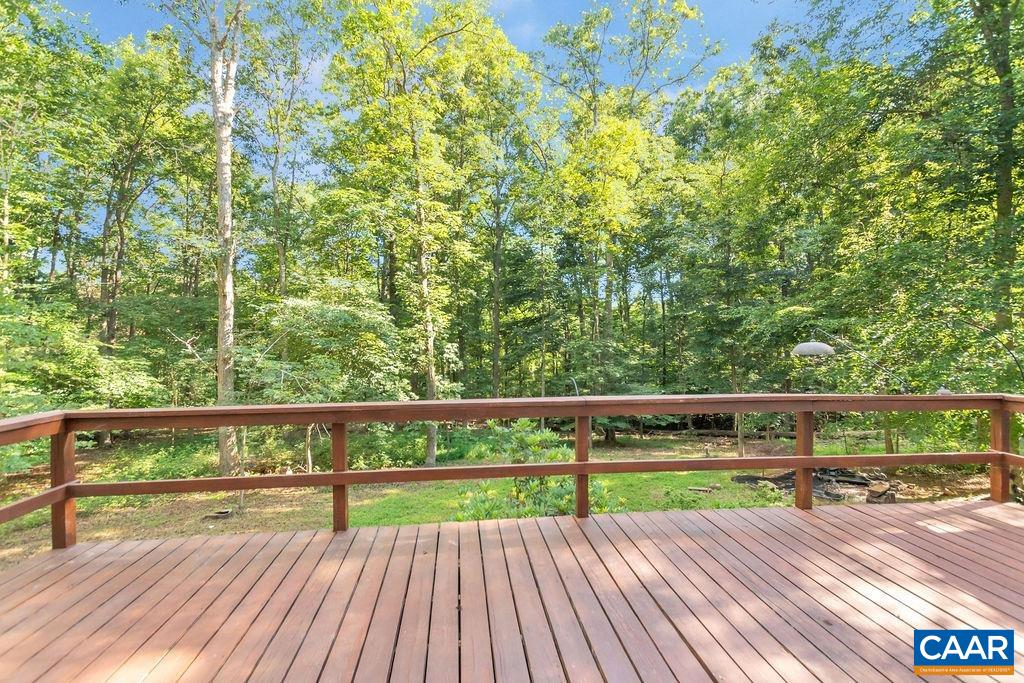 4875 Mechunk Road Keswick, VA 22947 - Photo 28 of 38 a view of small yard with wooden floor