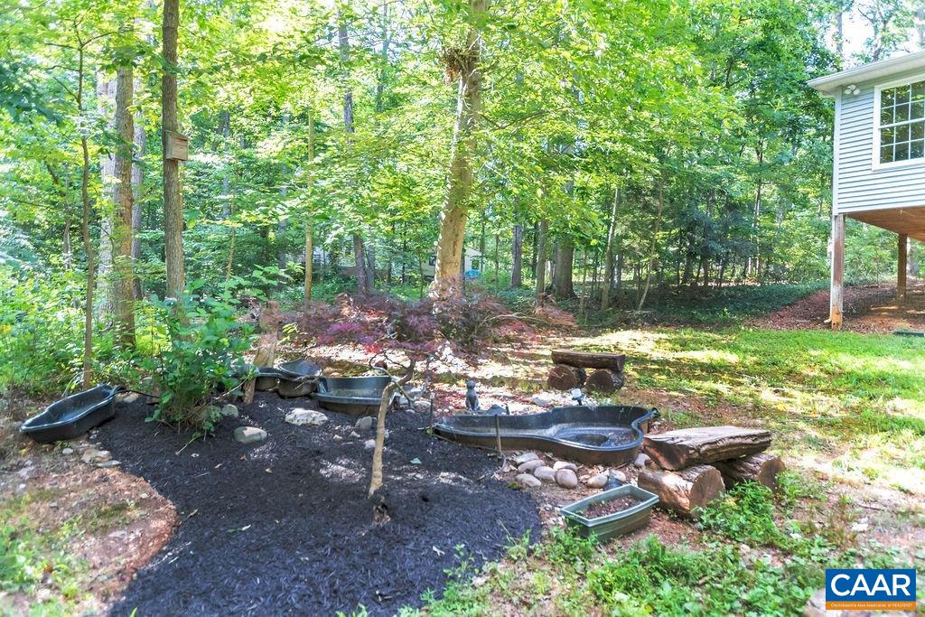 4875 Mechunk Road Keswick, VA 22947 - Photo 34 of 38 a view of a backyard with sitting area