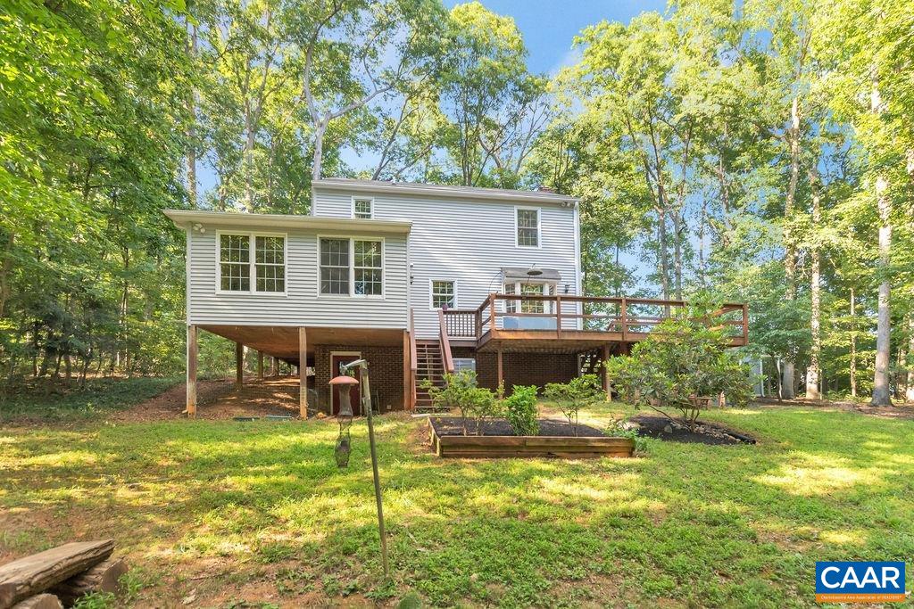 4875 Mechunk Road Keswick, VA 22947 - Photo 35 of 38 a view of a house with backyard porch and sitting area