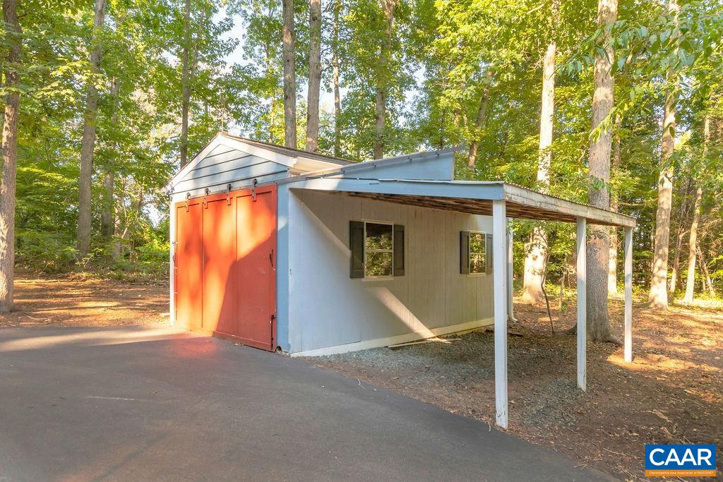4875 Mechunk Road Keswick, VA 22947 - Photo 37 of 38 a yellow house with a outdoor space
