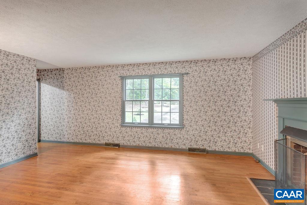4875 Mechunk Road Keswick, VA 22947 - Photo 4 of 38 wooden floor in an empty room with a window