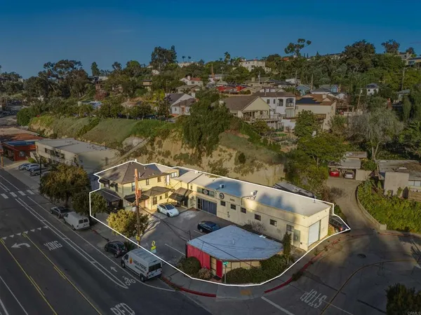 an aerial view of a house with outdoor space