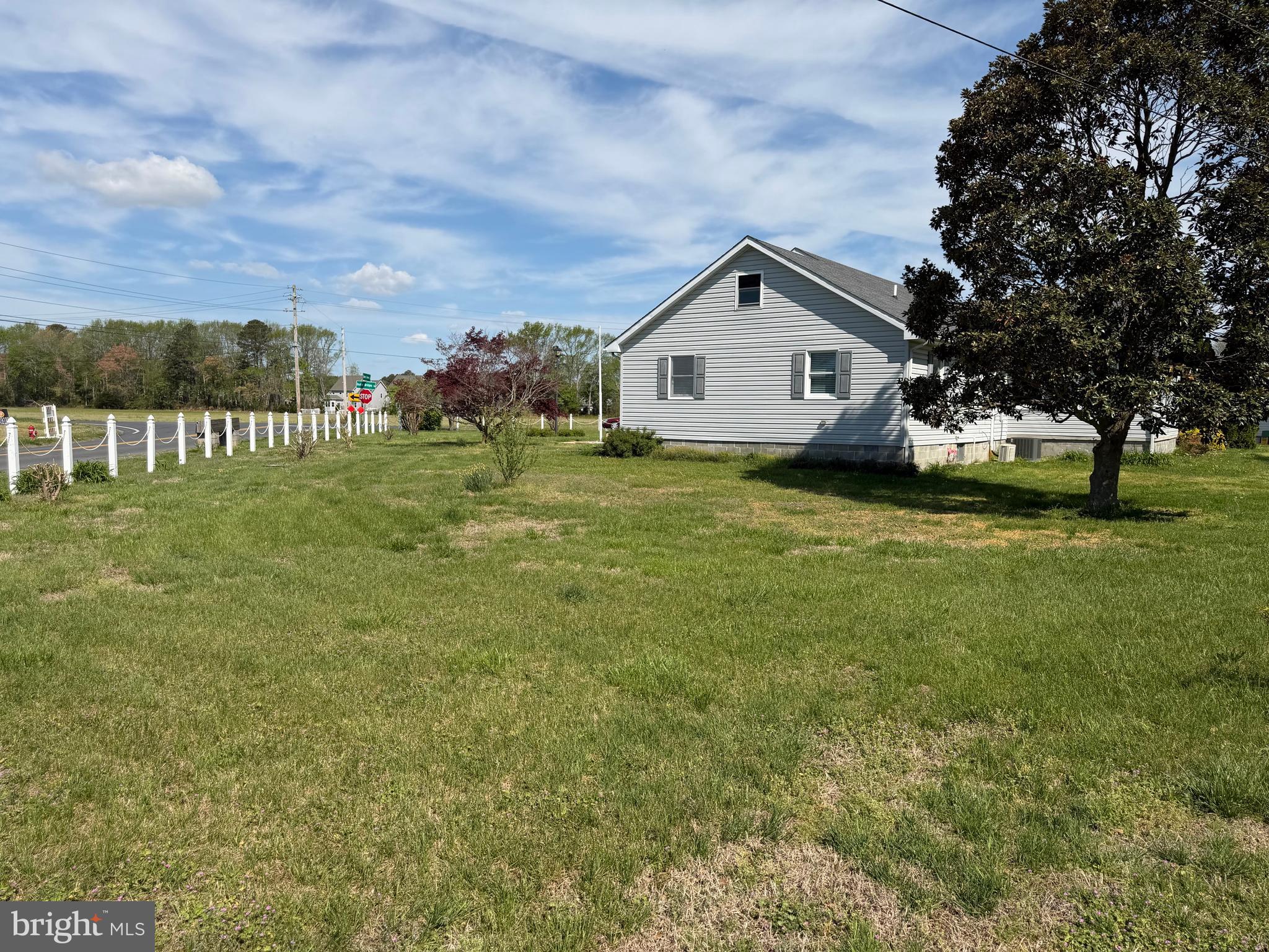 36032 Double Bridges Road Frankford, DE 19945 - Photo 11 of 51 a house view with garden space and trees