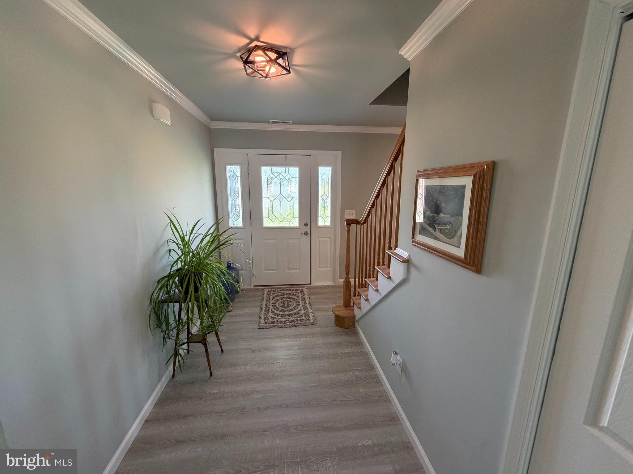 36032 Double Bridges Road Frankford, DE 19945 - Photo 15 of 51 a view of a hallway to a livingroom with furniture