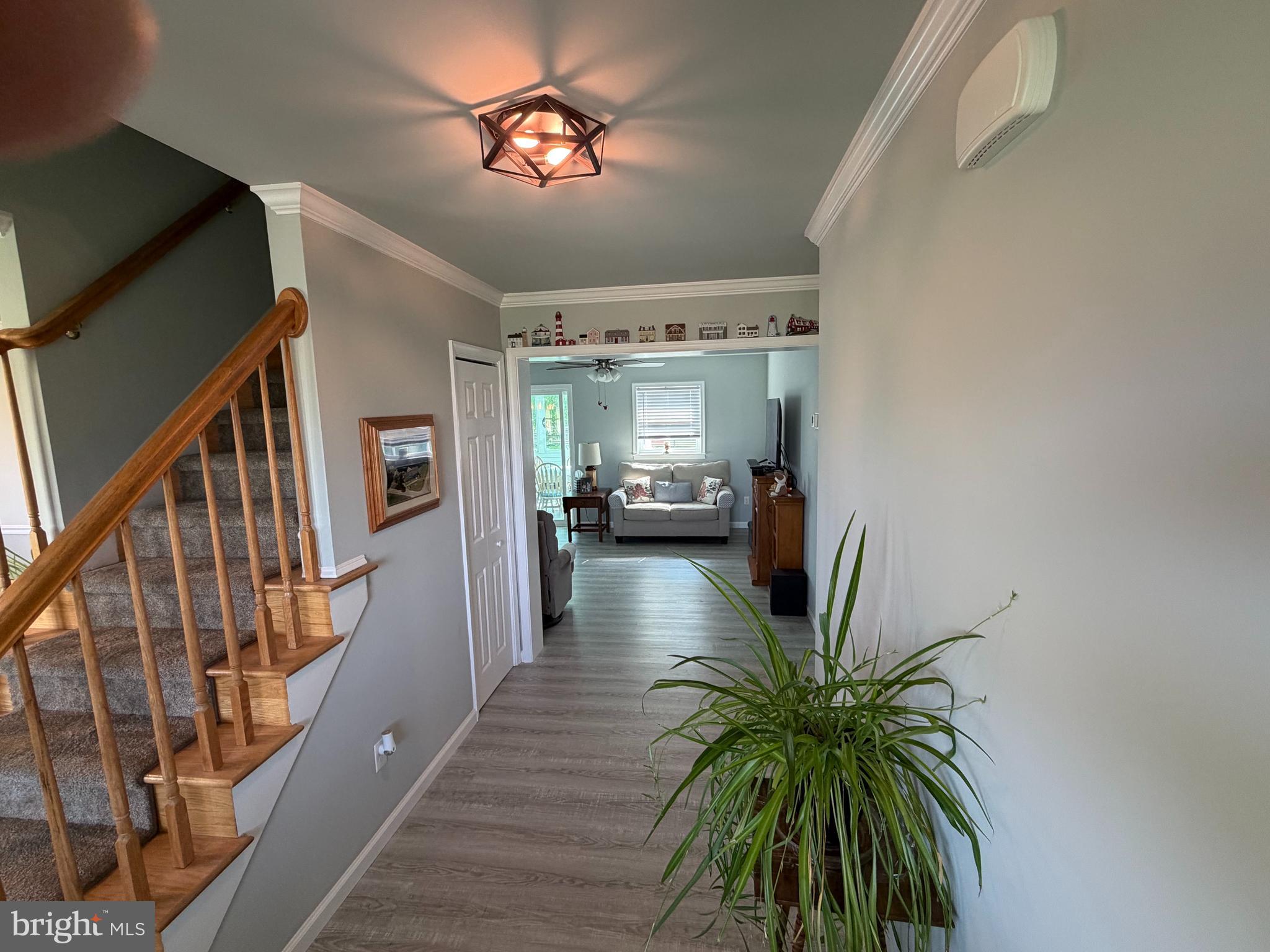 36032 Double Bridges Road Frankford, DE 19945 - Photo 16 of 51 a view of a hallway to a livingroom with furniture